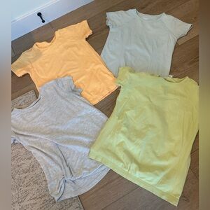 Athleta Girl lot of 4 shirts
Grey
Light blue
Light green 
Mustard yellow